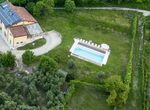 Aerial view of Villa Madamadoré's salt-water swimming pool beside the villa